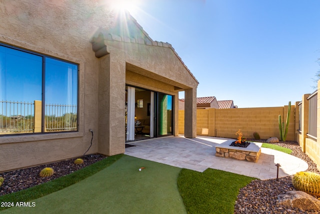 exterior space featuring an outdoor fire pit