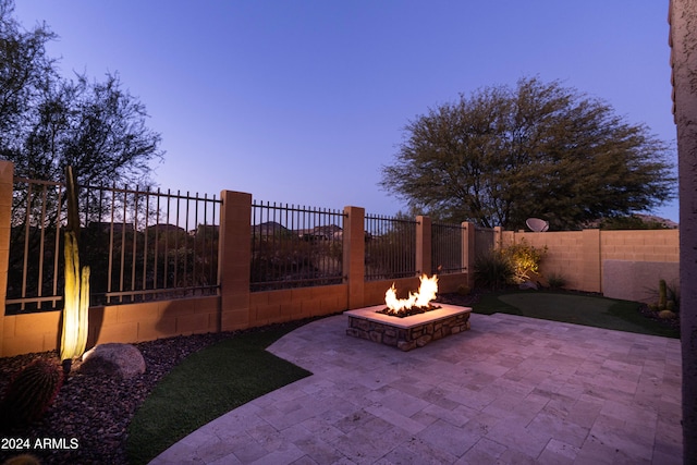 patio terrace at dusk with an outdoor fire pit