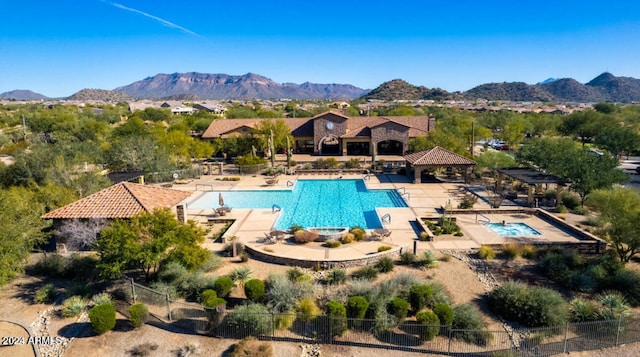 view of pool featuring a mountain view and a patio