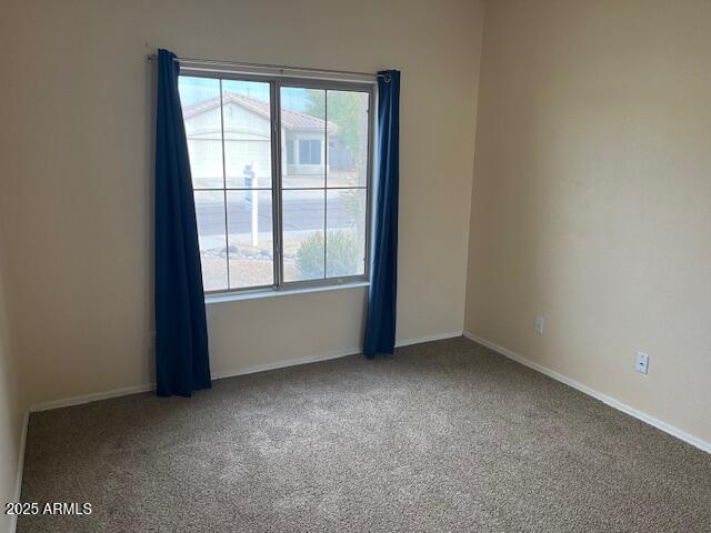 empty room featuring carpet flooring