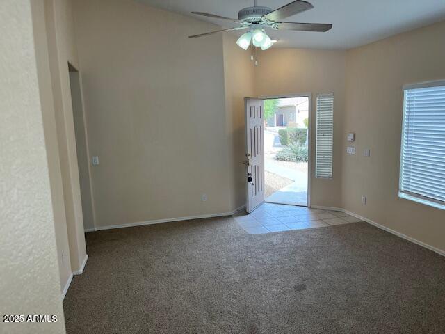 interior space featuring ceiling fan