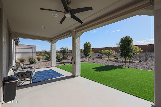 view of patio featuring a fenced backyard and ceiling fan