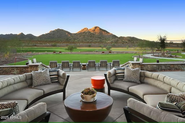 exterior space with a mountain view and an outdoor hangout area