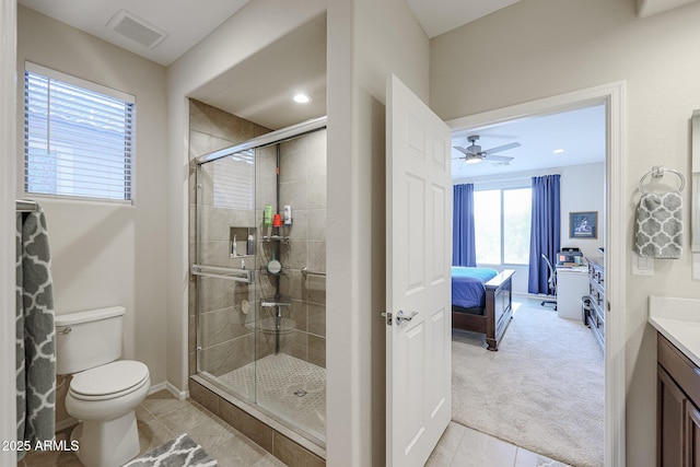 ensuite bathroom with toilet, vanity, visible vents, a shower stall, and ensuite bath