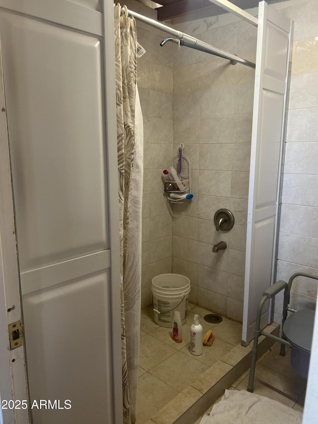 6226 W Citrus Way, Glendale, AZ 85301 - bathroom with a stall shower, tile patterned floors, and tile walls