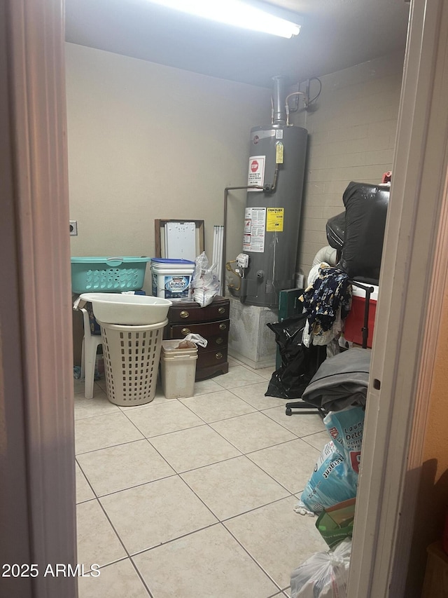 6226 W Citrus Way, Glendale, AZ 85301 - clothes washing area with water heater and tile patterned floors