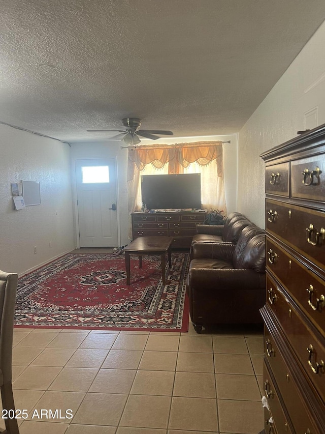 6226 W Citrus Way, Glendale, AZ 85301 - tiled living area with ceiling fan and a textured ceiling