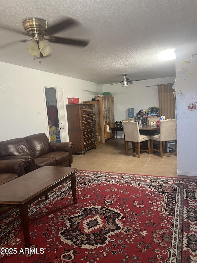 6226 W Citrus Way, Glendale, AZ 85301 - living room featuring ceiling fan, light tile patterned floors, and a textured ceiling