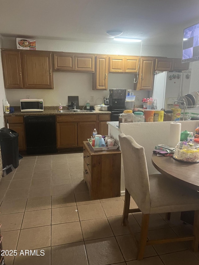 6226 W Citrus Way, Glendale, AZ 85301 - kitchen with black dishwasher, stainless steel microwave, white fridge with ice dispenser, light tile patterned floors, and a sink