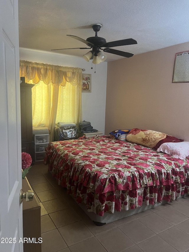6226 W Citrus Way, Glendale, AZ 85301 - bedroom with tile patterned flooring, ceiling fan, and a textured ceiling