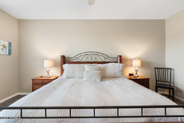 bedroom featuring baseboards and carpet floors