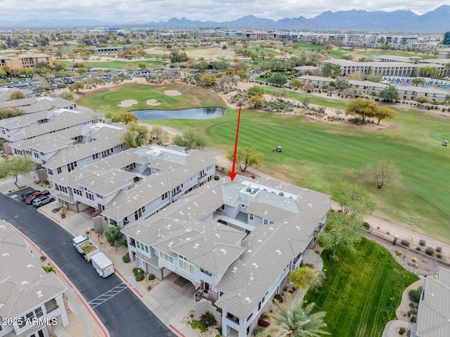 bird's eye view with a water and mountain view and view of golf course