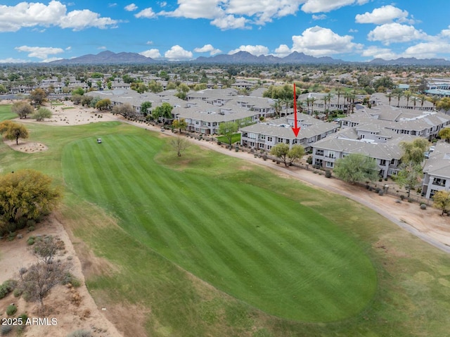 birds eye view of property featuring a residential view, a mountain view, and view of golf course