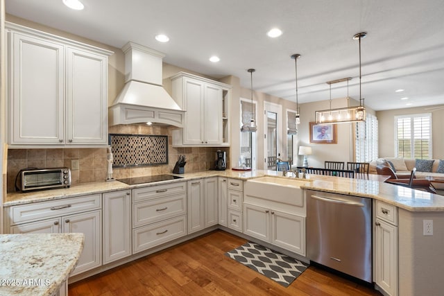 kitchen featuring custom range hood, a sink, a toaster, black electric stovetop, and dishwasher