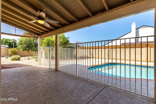 view of patio with a fenced backyard, a fenced in pool, and ceiling fan