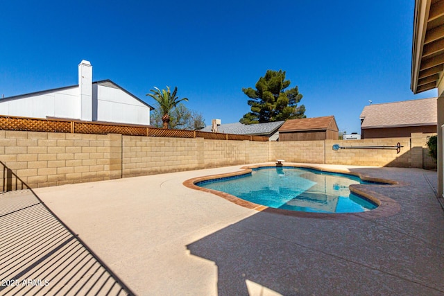 view of swimming pool featuring a fenced in pool, a patio, and a fenced backyard