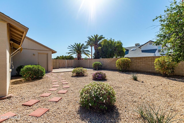 view of yard with a fenced backyard