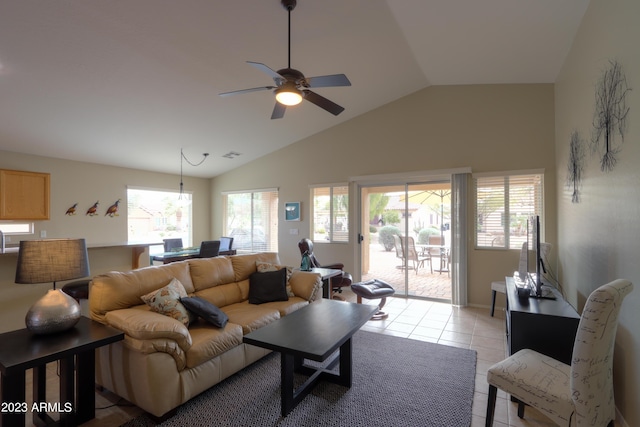 tiled living room with ceiling fan and vaulted ceiling