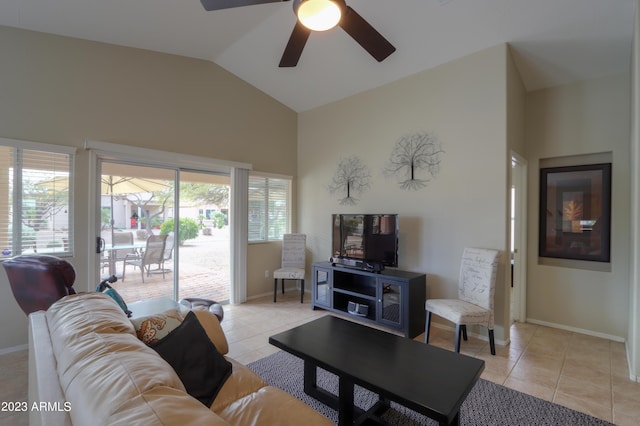 living room with ceiling fan, vaulted ceiling, and light tile patterned floors