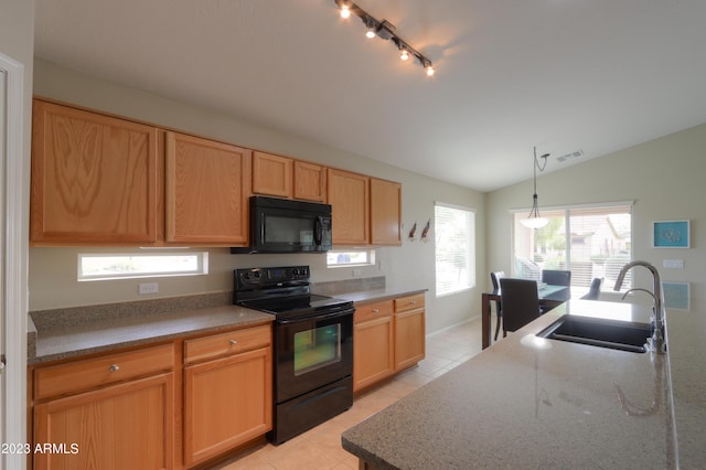 kitchen with light tile patterned flooring, sink, decorative light fixtures, vaulted ceiling, and black appliances