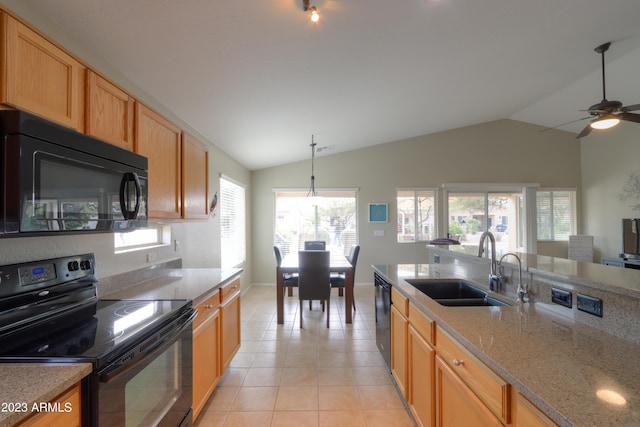 kitchen with lofted ceiling, sink, hanging light fixtures, light tile patterned floors, and black appliances