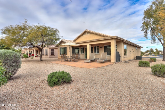 rear view of property with a patio area