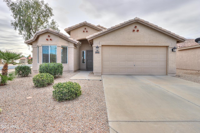 view of front of property with a garage