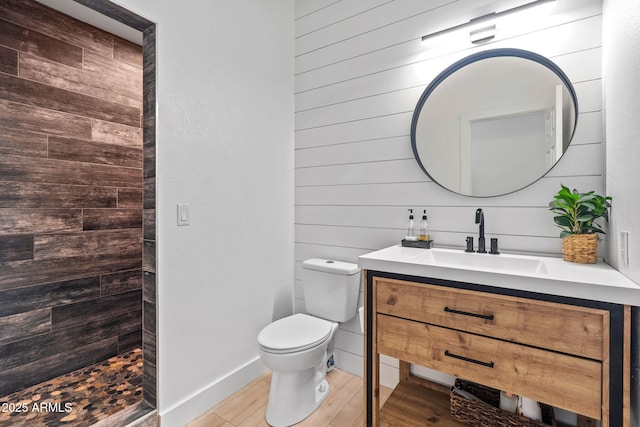 6935 W Monte Lindo St, Glendale, AZ 85310 - full bath with vanity, tiled shower, wooden walls, and wood finished floors