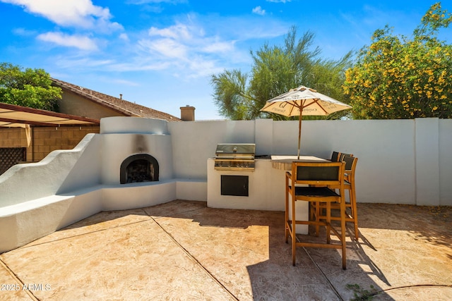 6935 W Monte Lindo St, Glendale, AZ 85310 - fenced backyard with an outdoor kitchen and a patio