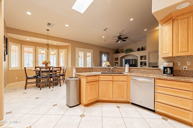 kitchen featuring plenty of natural light, dishwasher, and light brown cabinets