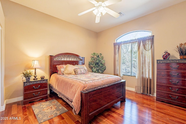 bedroom featuring hardwood / wood-style flooring and ceiling fan