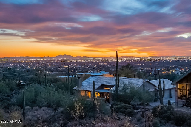 property's view of city with a mountain view