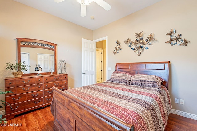 bedroom featuring dark hardwood / wood-style floors and ceiling fan