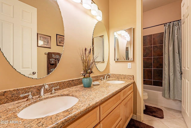 full bathroom with tile patterned floors, toilet, shower / bath combo with shower curtain, and vanity