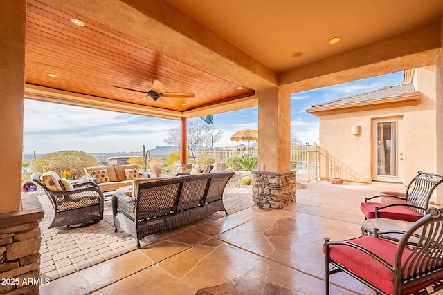 view of patio featuring an outdoor hangout area and ceiling fan