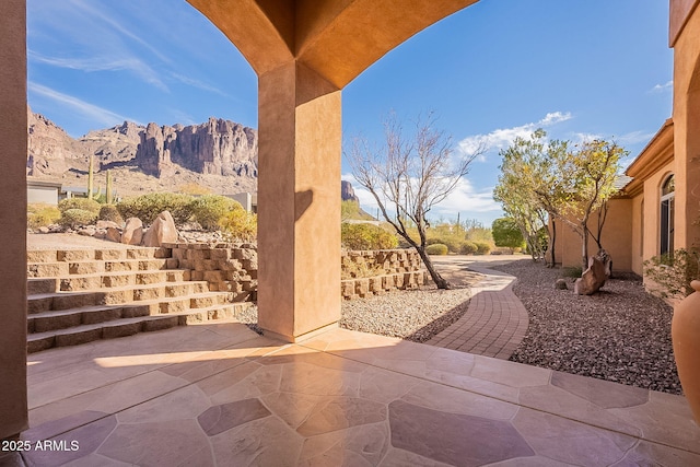 view of patio / terrace with a mountain view