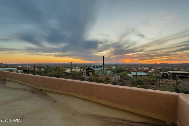 view of balcony at dusk