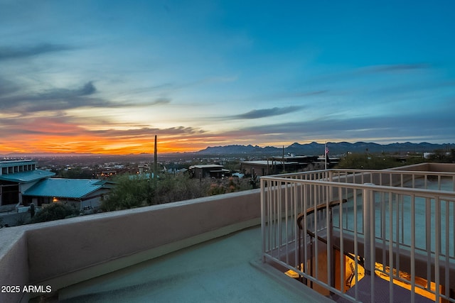 balcony at dusk with a mountain view