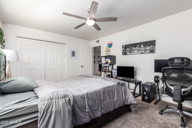 bedroom with carpet flooring, ceiling fan, and a closet