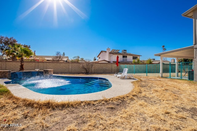 view of swimming pool with pool water feature