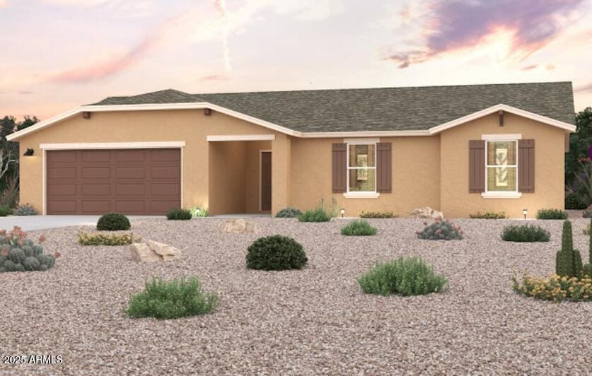 single story home featuring an attached garage, roof with shingles, concrete driveway, and stucco siding