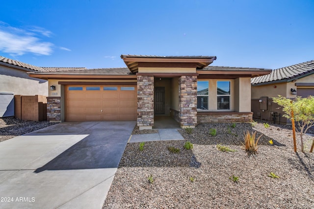 prairie-style house featuring a garage