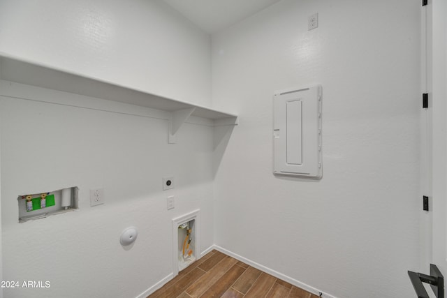 washroom with hookup for an electric dryer, washer hookup, electric panel, and hookup for a gas dryer