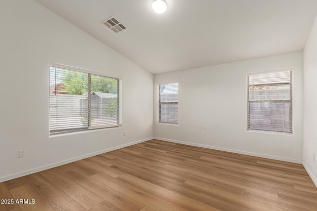 10212 E Caballero St, Mesa, AZ 85207 - empty room featuring light wood-style floors and lofted ceiling