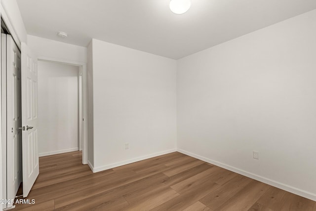 10212 E Caballero St, Mesa, AZ 85207 - empty room featuring wood finished floors and a smoke detector