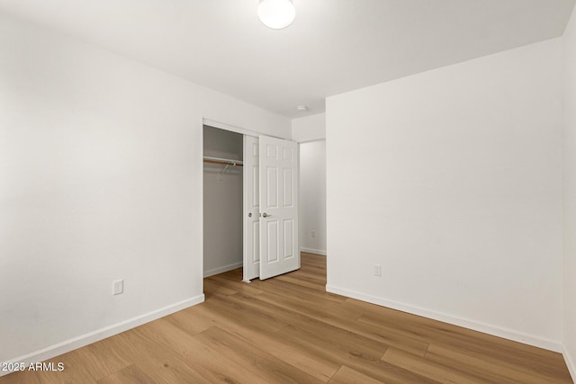 10212 E Caballero St, Mesa, AZ 85207 - unfurnished bedroom with wood finished floors and a closet