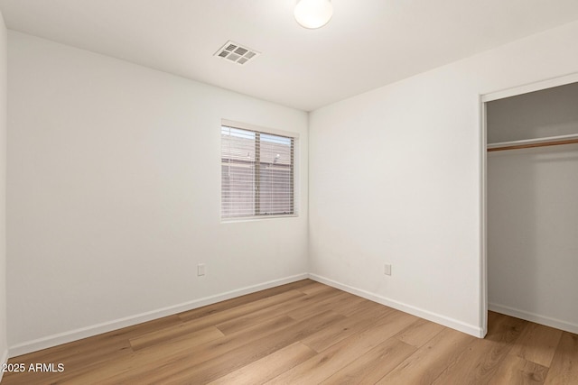 10212 E Caballero St, Mesa, AZ 85207 - unfurnished bedroom featuring light wood-type flooring and a closet
