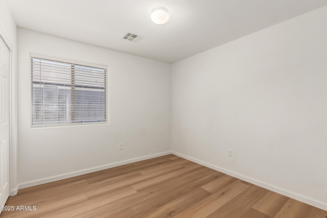 10212 E Caballero St, Mesa, AZ 85207 - spare room featuring light wood-style flooring and baseboards