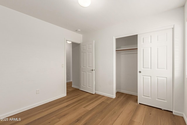 10212 E Caballero St, Mesa, AZ 85207 - unfurnished bedroom featuring wood finished floors and a closet