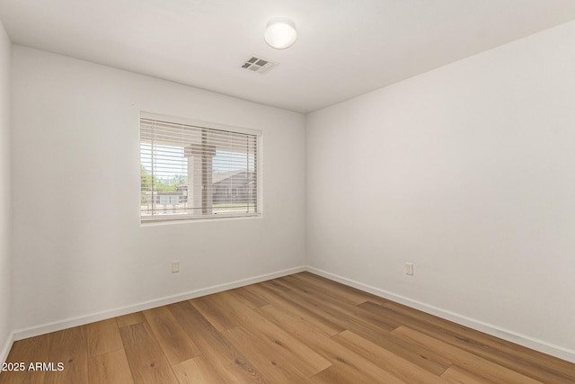 10212 E Caballero St, Mesa, AZ 85207 - empty room with light wood-style flooring and baseboards